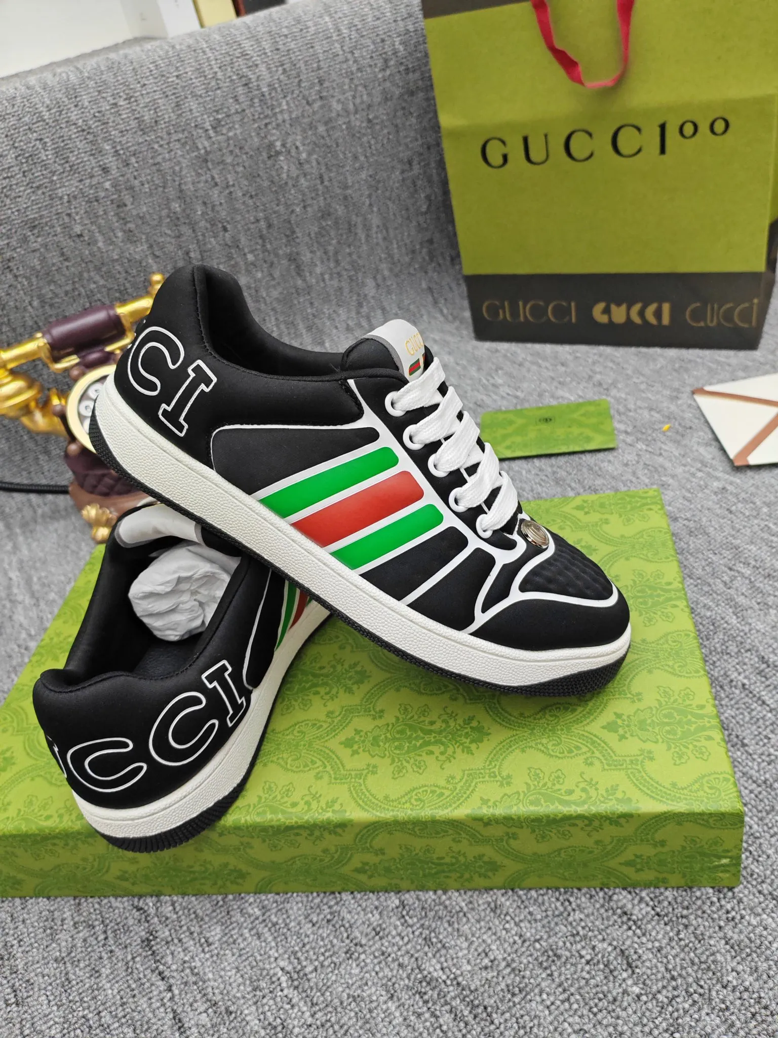 Factory price 600💰Screener series embellished web sneakers. This item is from the Gucci Lido series. Its design is inspired by the summer style and beach clubs of the Italian coast. The Screener series of sneakers draws inspiration from classic sneakers from the 1970s and takes its name from a special defensive move in sports. This shoe from the 2024 Pre-Fall collection is crafted from yellow rubber, a technical and malleable opaque material, with striped webbing on the sides and an embossed Gucci printed logo on the heel. Yellow rubber, opaque and technological in appearance. Red and green webbing decorated with metal Double G oval enamel details. Gucci printed embossed logo. Women 35-40, men 38-45, (men 38 and 45 need to be customized)